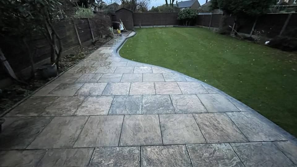 Complete garden landscaping project with curved patio and lawn by RY Garden & Landscaping