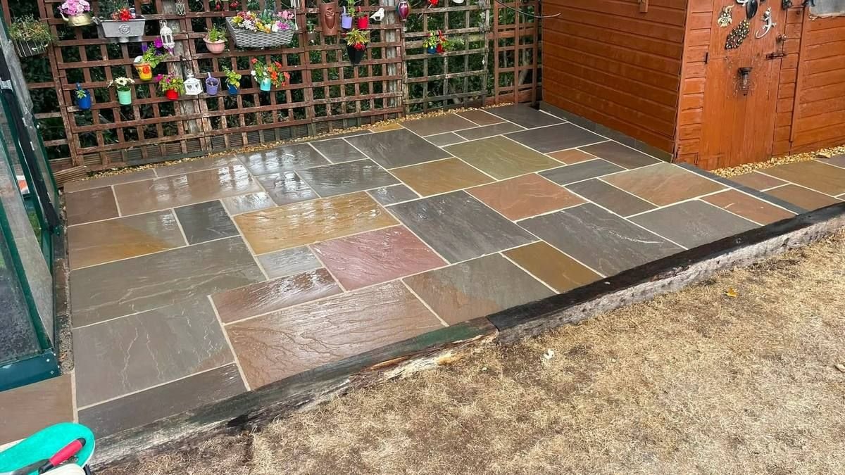 Multi-colour Indian sandstone patio laid by RY Garden & Landscaping in Manchester